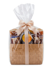 Elegant wicker gift basket with assorted food gifts decorated with ribbon and plastic transparent wrap