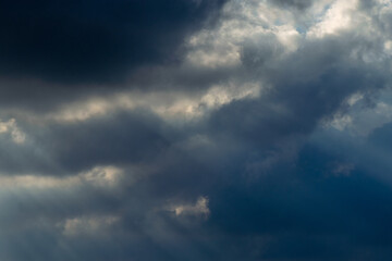 Fototapeta premium Sun Rays Breaking Through Storm Clouds