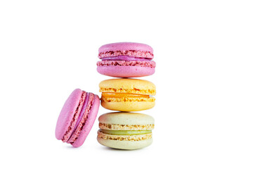 Stack of colorful French macarons isolated on white background.