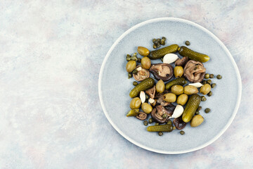 Marinated olives mushrooms and cucumbers, salted mushrooms