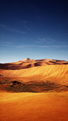 A barren desert landscape under a clear blue sky, showcasing the vastness and emptiness of the arid terrain.