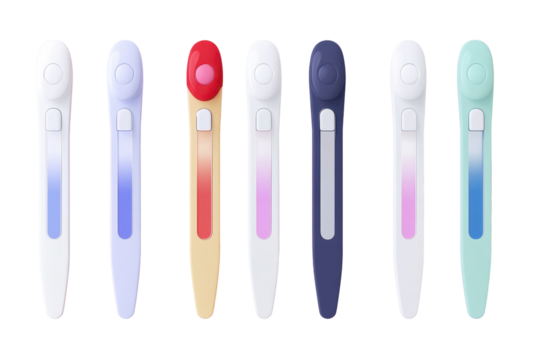 Collection of various colored pregnancy tests in a row, set on a pink background
