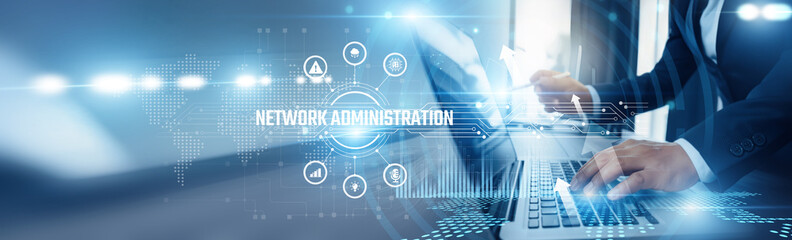 Businessman using laptop and network administration analyzing technological data, server...