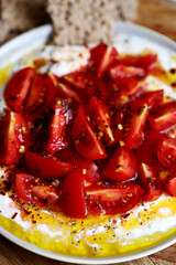 Tomatoes with white sauce and olive oil