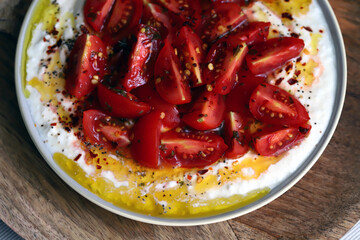 Tomatoes with white sauce and olive oil