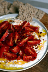 Tomatoes with white sauce and olive oil
