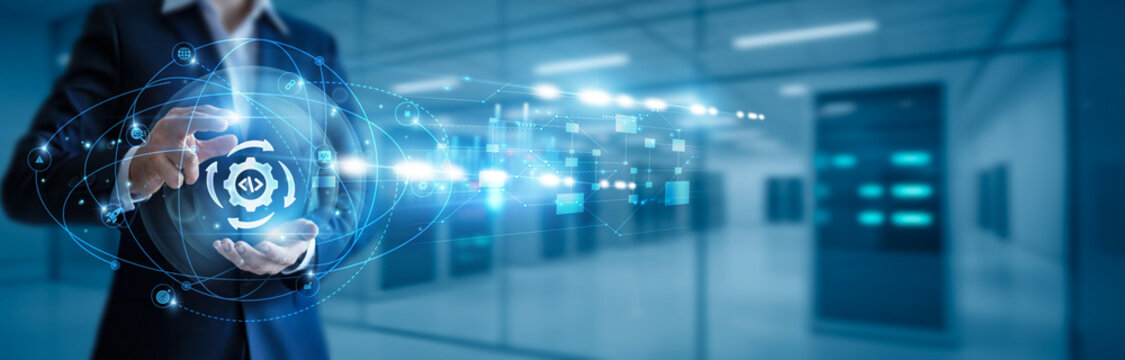 Businessman hand hold DevOps, CI/CD pipelines, cloud deployment, software automation, agile development, infrastructure as code, containerization, Kubernetes solutions, continuous monitoring