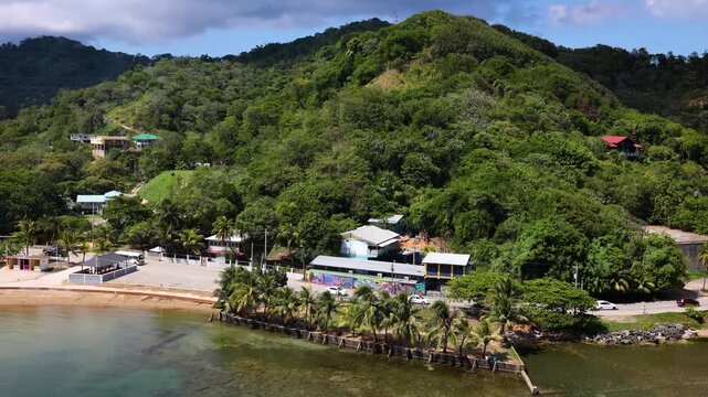 Shoreline road with moderate traffic on Caribbean island of Roatan in Honduras