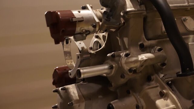 Low angle view of large size engine layout with its distinct twelve-cylinder design in a V configuration commonly used in high-end or historic sports cars performance like luxury racing automobiles