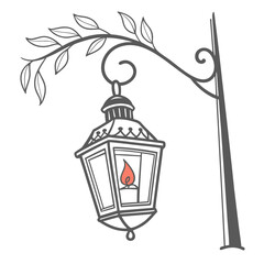 Vintage candle lantern with flame on branch glowing