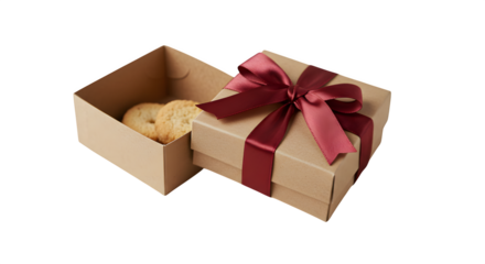 Brown box with satin ribbon holds cookies on black. Gift photography, product presentation, holiday branding.