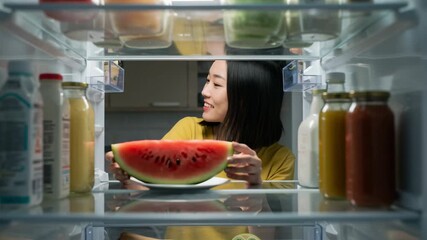 Asian woman putting groceries in fridge, fresh food storage and lifestyle concept - Powered by Adobe