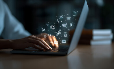 Person using laptop with digital education icons floating