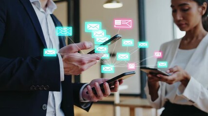 Business colleagues are using smartphones with email notification icons exchanging messages and experiencing notification stress and communication overload in a modern office environment - Powered by Adobe