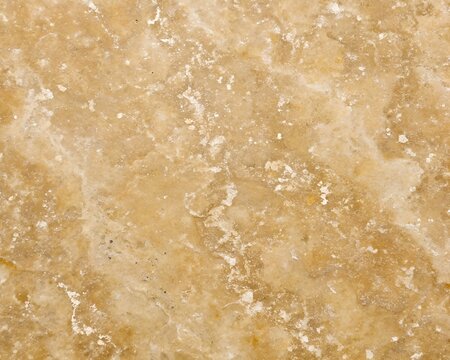 Macro photograph of a beige and yellow marble stone texture with white crystalline inclusions and dark speckles - Powered by Adobe