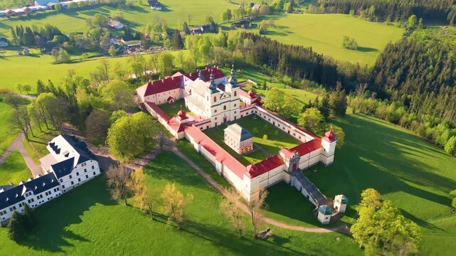 Experience the serene beauty of the Church of the Assumption of the Virgin Mary on the Mountain of the Mother of God, a sacred site and pilgrimage destination in Kraliky, Czechia.