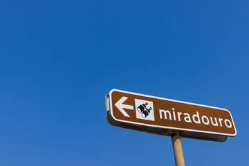 Fototapeta premium A brown directional sign for a 