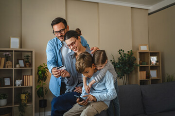 Family online shopping using credit card on smart phone