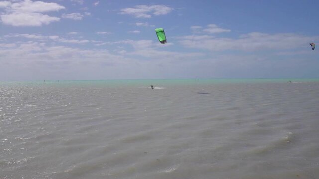 Kitesurfer Jumping Over Ocean Waves at Sunset in the Florida Keys