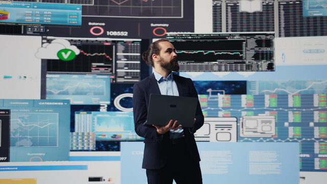 Data driven planning helps this professional to build a successful strategy for global business development. Using charts on dashboard and projections to guide his leadership ideas. Camera B.