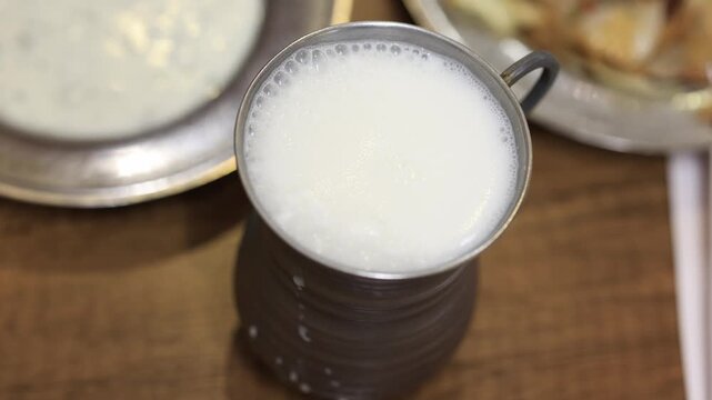 Close-Up of Traditional Turkish Ayran Served in a Metal Cup
