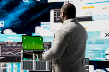Black executive manager studying copy space screen with data insight for business growth,...