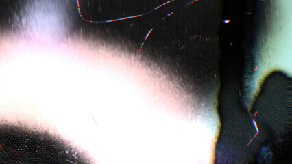 Vintage style white film burn overlay with soft light, grain, and bokeh particles on black.