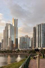 Tourist Binoculars on Panama City Promenade with Modern Skyline at Sunset