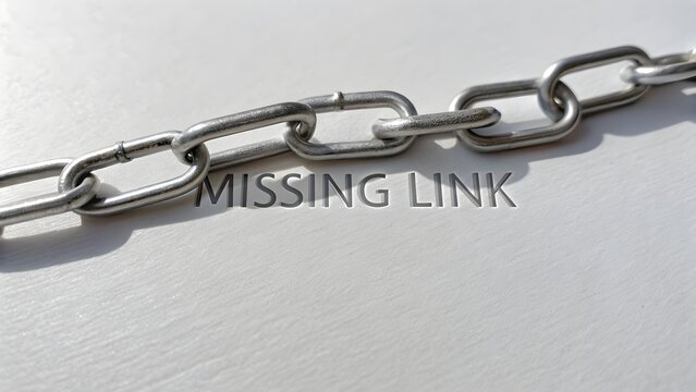 A Silver Chain with Missing Link on a White Surface