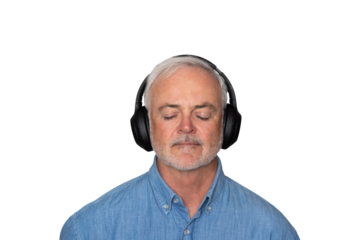 Close up portrait of handsome Mature man listening to music with headphones  against a transparent background.