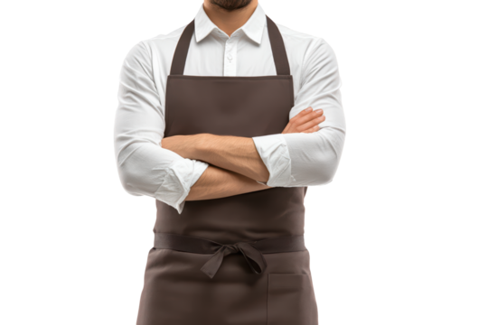A confident man wearing a white shirt and a brown apron stands with his arms crossed against a plain black background, isolated on transparent background, perfect cutout, PNG