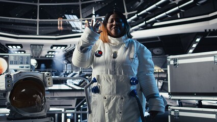 Joyous astronaut greeting command center researchers during videocall, presenting analysis findings. Smiling orbit station crew member provides scientific findings to Earth team