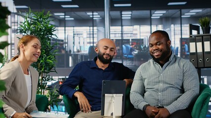 Corporate meeting where multicultural partners collaborate through video call, applying strategic thinking and teamwork to align goals and support career and company success. Camera B.