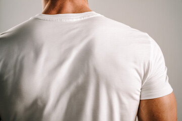 White t-shirt mockup on male model viewed from back