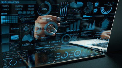 A close-up of a hand interacting with a digital interface displaying business analytics and data...