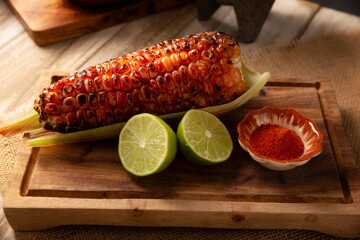 Grilled corn. A typical Mexican street food, where it's known as Elote Asado, it's a...
