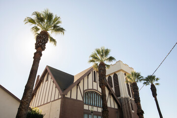 Beautiful trees frame a historic church in downtown Corona, California, USA.