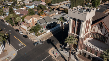 Beautiful trees frame a historic church in downtown Corona, California, USA.