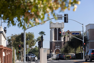 Beautiful trees frame a historic church in downtown Corona, California, USA.