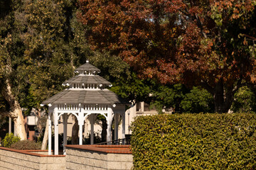 A gazebo stands in a public park in downtown Corona, California, USA.
