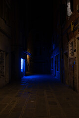 Dark Venice Alleyway with Blue Light at Night