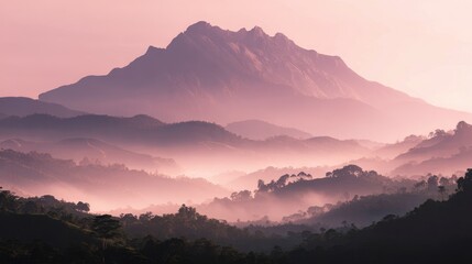 Obraz premium Majestic Mountain Silhouette at Sunrise with Misty Layers