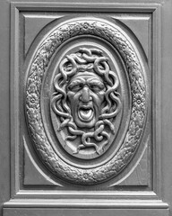 France, Paris. Close-up detail of a Medusa (gorgon) head carving.