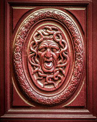 France, Paris. Close-up detail of a Medusa (gorgon) head carving.