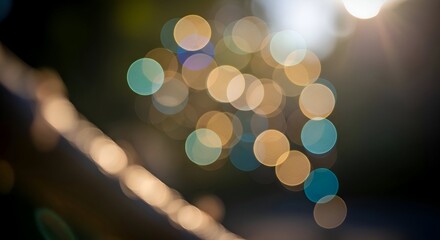 Obraz premium Abstract Blurred Lights with Teal and Gold Bokeh on Dark Backgro