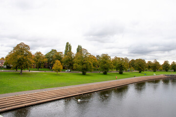A landscape view with the river Trent and trees turning colour as autumn approaches.