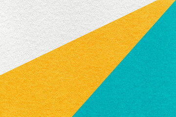 Fototapeta premium Abstract old geometric paper background with white, yellow and turquoise rays, texture for banner, template