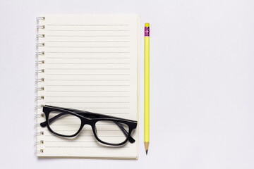 Empty notebook arranged on blue background.