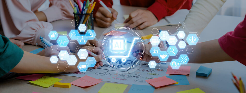 Diverse hands engage in a collaborative process around a table filled with notes and technology icons, symbolizing creativity and teamwork in a modern workspace environment. Trope