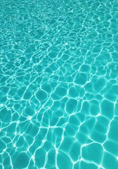 Cool Tranquility: This image captures the serene beauty of a pool, its surface shimmering with a play of light and shadow, evoking feelings of freshness, calmness and relaxation.